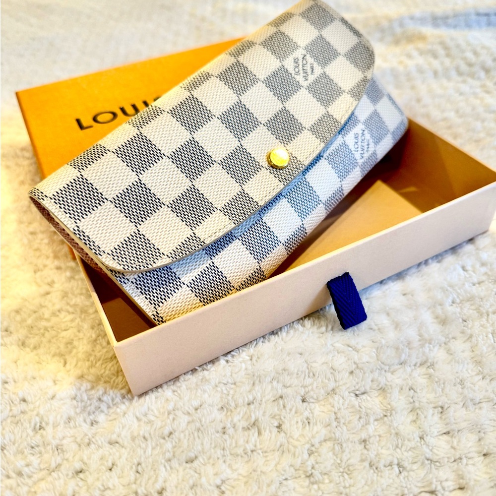 Used once Louis Vuitton wallet with duster and box.